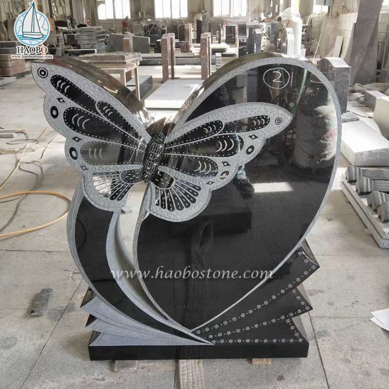 Coração de granito preto com lápide memorial esculpida em borboleta
